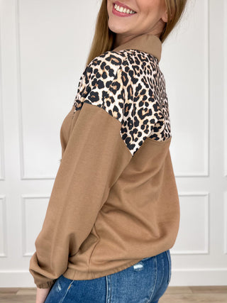 Long sleeve quarter-zip pullover top, brown with leopard print sleeves and gold zipper