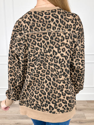 Leopard print long-sleeve top with open back yoke detail and dropped shoulders