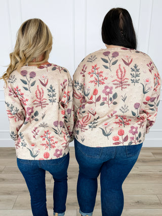 Oat knit long-sleeve sweater with colorful floral print, shown from back view