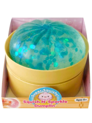 Teal glitter squishy dumpling toy in yellow base with capsule packaging