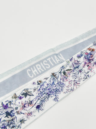Floral handbag scarf with purple-blue floral print and a silver 'CHRISTIAN' band