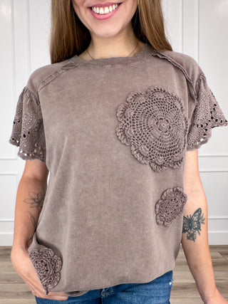 Brown cotton short-sleeve top with lace floral applique on chest and sleeves