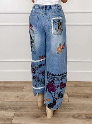 High-rise barrel-leg jeans, medium wash denim with printed patchwork on legs