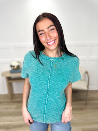 Teal cotton short-sleeve sweater top with ribbed crew neckline and center seam