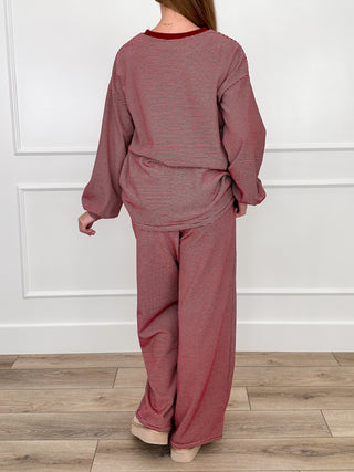 Burgundy two-piece lounge set, long-sleeve pullover and drapey wide-leg pants