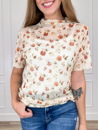 Cream sheer mesh short-sleeve top with brown floral print and high neckline