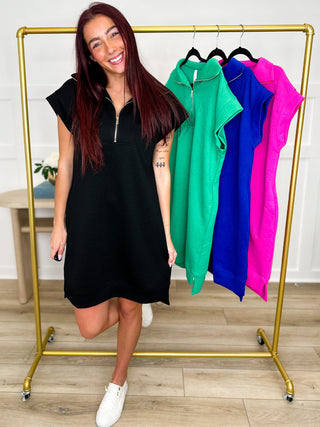 Black knit shift dress with short sleeves and half-zip front