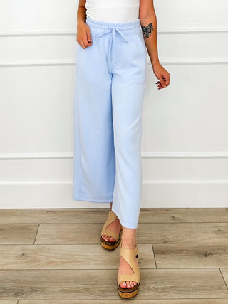 Light blue high-rise wide-leg bottoms with elastic drawstring waist
