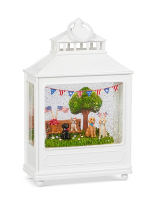 White water lantern with clear window display of animals, tree, and star garland