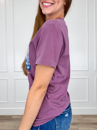Purple cotton crew-neck graphic tee with floral scripture print, short sleeves