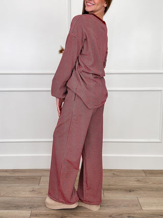 Burgundy two-piece lounge set with long-sleeve top and wide-leg pants (back view)