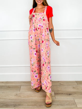 Pink floral printed overalls with front bib and adjustable shoulder straps