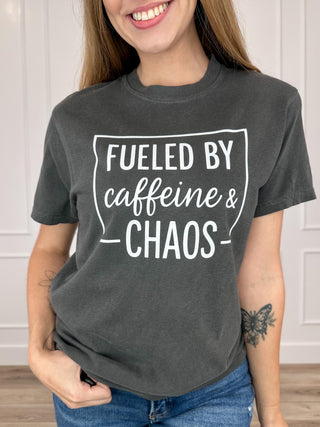 Grey short-sleeve graphic T-shirt with front text "Fueled by caffeine & chaos"