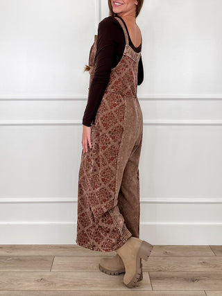 Brown patchwork cotton jumpsuit with front bib detail and wide legs, side view