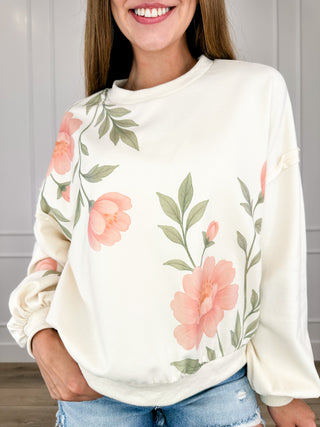 Cream cotton-blend long sleeve pullover top with floral print, round neckline