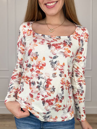 Women's cream floral knit long-sleeve top with scoop neckline and cuffed sleeves