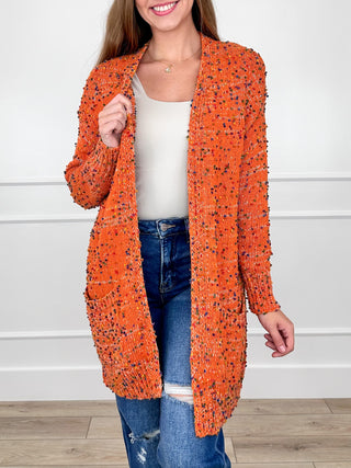 Knit long-sleeve cardigan with open front, speckled orange and dark flecks