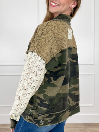 Women’s camo long-sleeve jacket with button closure, quilted tan back, and lace sleeves