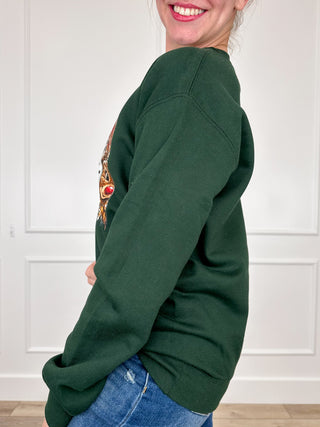Green long-sleeve crewneck sweatshirt shown from the side, with a ribbed hem and cuffs