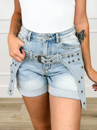 Light wash denim high-rise shorts with gold studs and curved front belt buckle.
