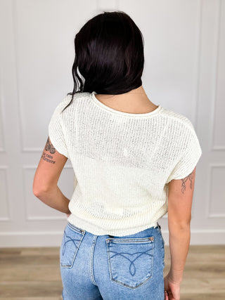 Cream knit short-sleeve V-neck top, back view with short sleeves