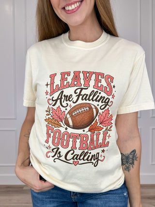 Cream cotton short-sleeve graphic tee with "Leave Football Is Calling" print