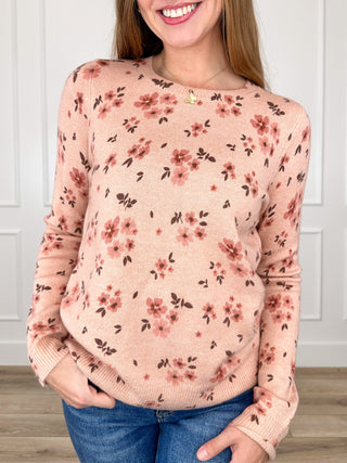 Pink knit long-sleeve sweater with small floral print, crew neckline