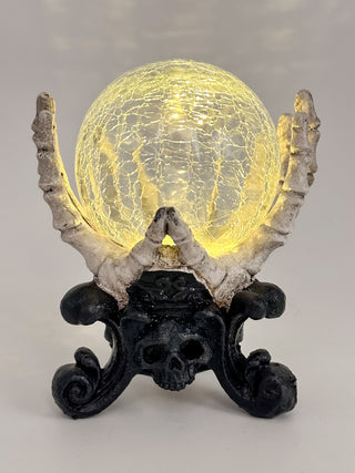 LED globe decor with yellow cracked globe, skull centerpiece, dark ornate base