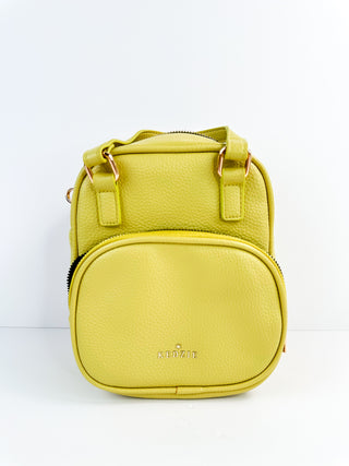 Lime faux leather mini backpack bag with front zipper pocket and top zip closure
