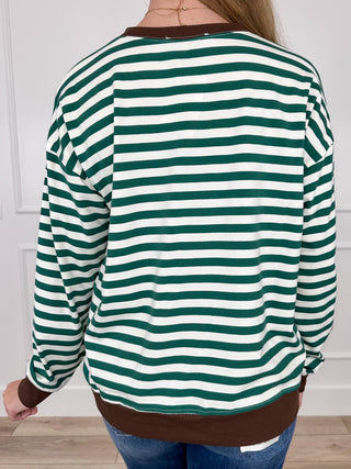 Green and white striped long-sleeve top, back view with crew neckline and ribbed hem