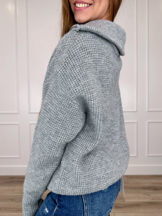 Heather grey knit quarter-zip sweater with hooded stand collar and long sleeves