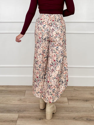 Cream high-rise wide-leg cropped pants with multicolor floral print, full-length view