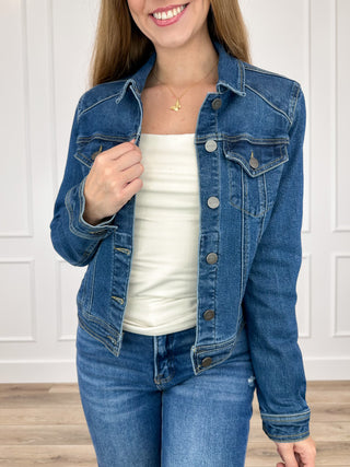 Dark wash cropped denim jacket with long sleeves, button front, flap chest pockets