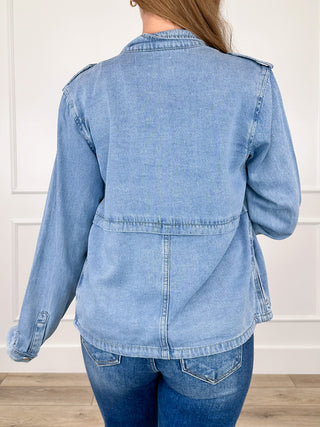 Medium-wash denim jacket with back yoke, long sleeves, button cuffs