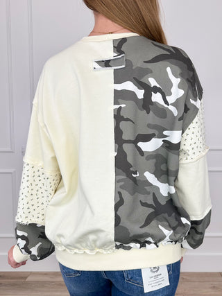 Back of cream long-sleeve crewneck top with large camouflage print panel