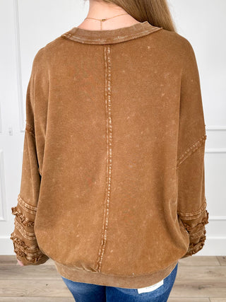 Brown long-sleeve cotton tunic with back yoke seam and ruched ruffle-trim sleeves
