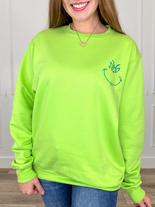 Lime green crewneck sweatshirt with small reindeer graphic on the chest.