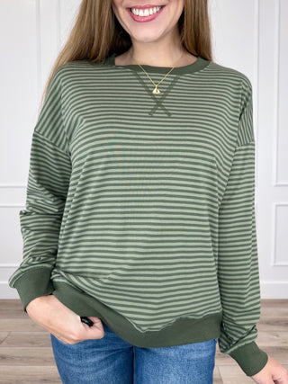 Green striped long-sleeve top with crew neck and ribbed cuffs