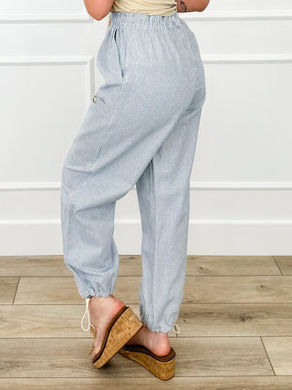 High-rise pinstripe joggers with drawstring waist, ankle cuffs, side pockets