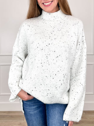 White speckled knit turtleneck long-sleeve sweater, relaxed fit