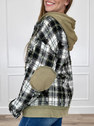 Side view of green plaid hooded jacket with long sleeves and front pocket