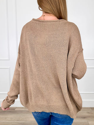 Tan knit long-sleeve sweater back view with dropped shoulders and ribbed hem