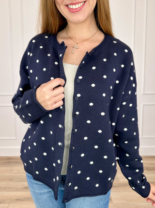 Navy knit button-up cardigan with white dot pattern, long sleeves