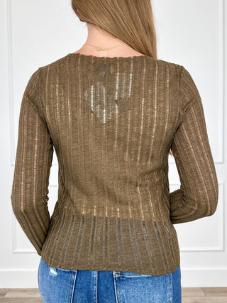 Brown long-sleeve knit top with textured vertical stripes, back view