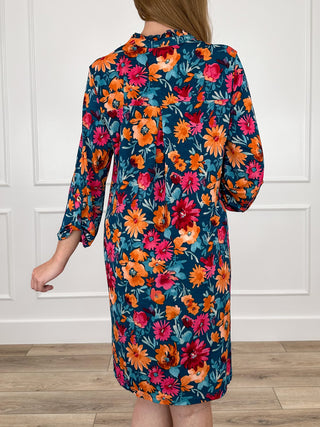 Back view floral teal Gabby dress with long sleeves
