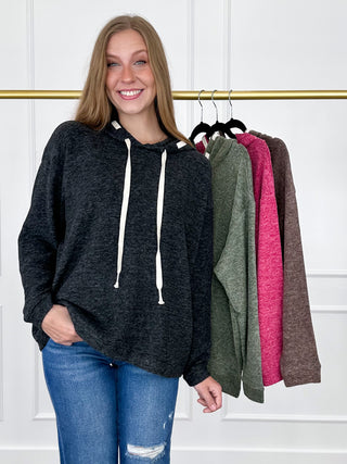 Black heather knit long-sleeve hooded top with white drawstring ties.