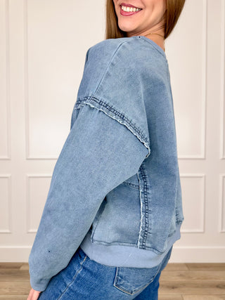Light blue cotton-blend cropped long-sleeve top with seam detail and stitching