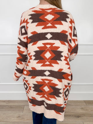 Cream knit long-sleeve cardigan with Aztec geometric pattern and ribbed hem