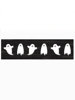 Wood shelf sitter plaque with a row of white ghost cutouts