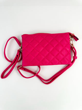 Hot pink quilted faux-leather crossbody bag with zip top and crossbody strap